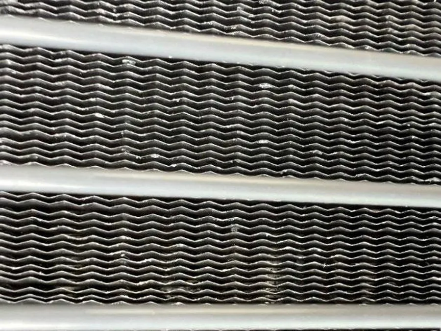 Aluminum condenser coil descaled on an occupied site