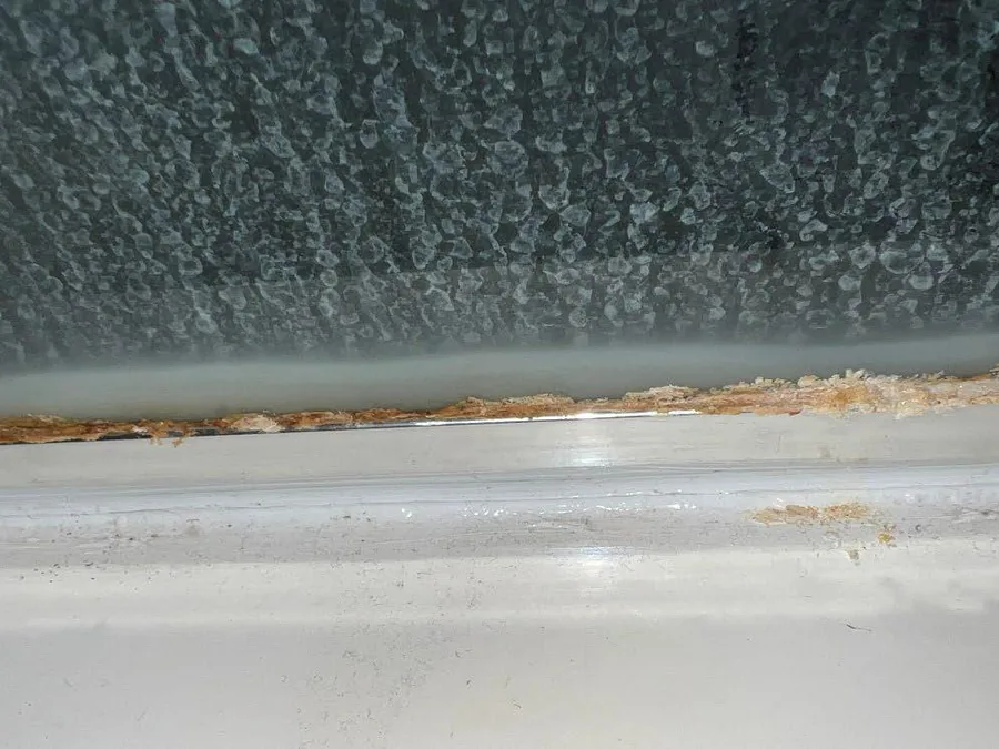 Glass and track heavy with calcium scale before Descaler