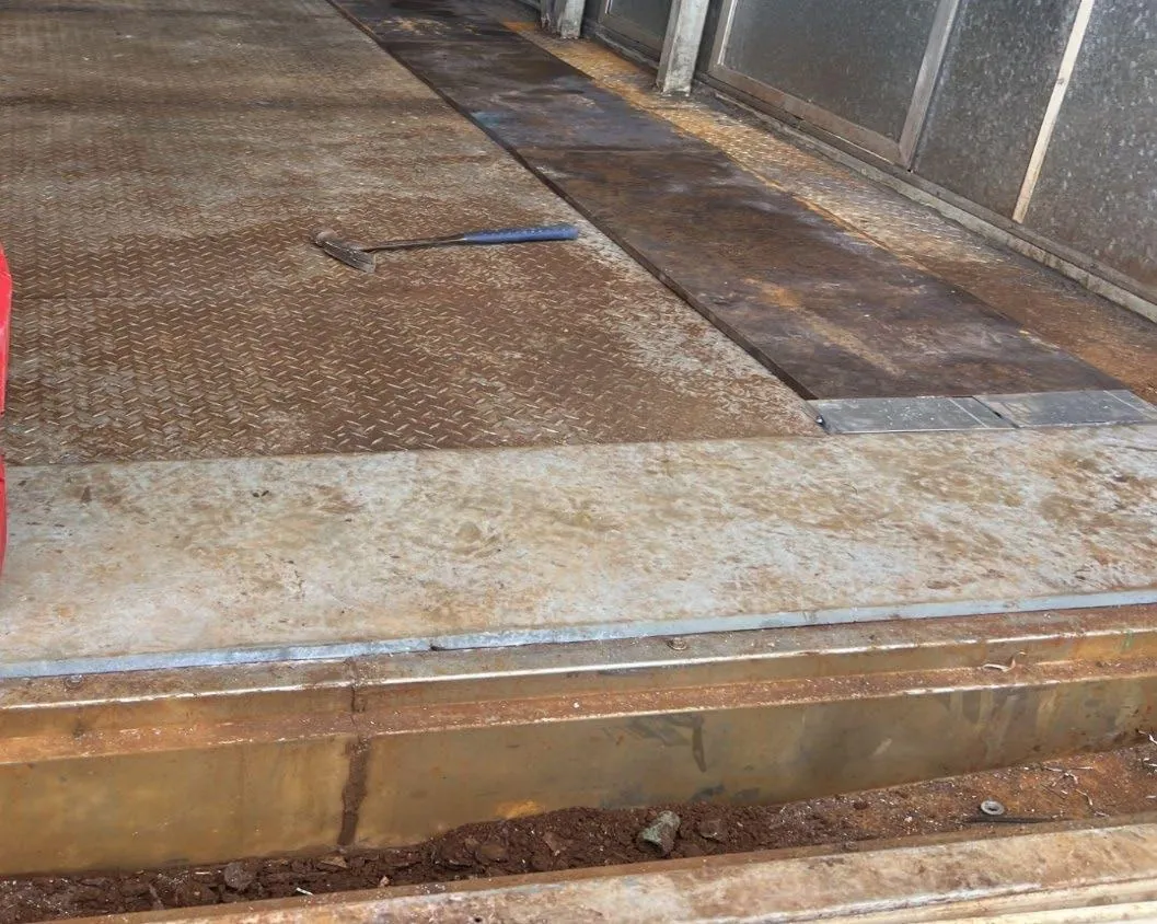 Rust and scale on Brevard County farm diamond-plate before cleaning